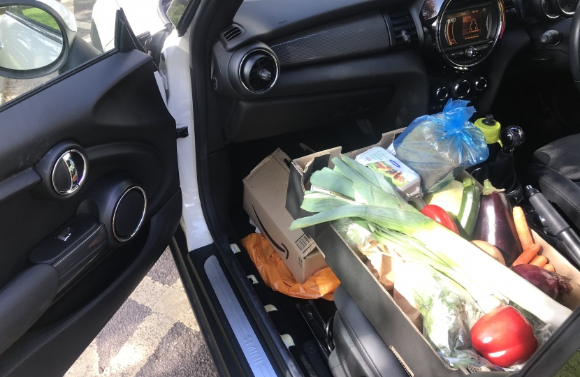 Theresa Villiers drops off food for residents in Station Road