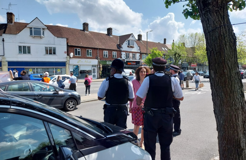 Theresa Villiers MP talking to police officers in New Barnet