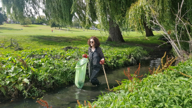 Theresa Villiers joins a volunteer group cleaning up Pymmes Brook